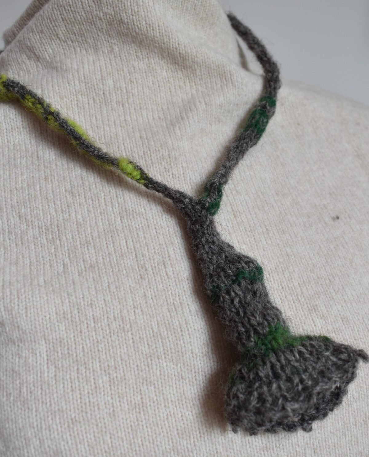grey and green knitted wool necklace