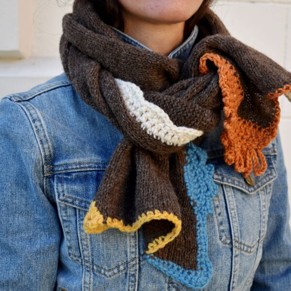 brown knitted scarf with colourful crochet details